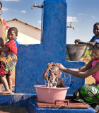 Women and children enjoy new access to an improved piped water supply in Mozambique as a result of WADA’s first project in the country, implemented from 2007–2010. Photo Credit: Brent Stirton/Verbatim Agency